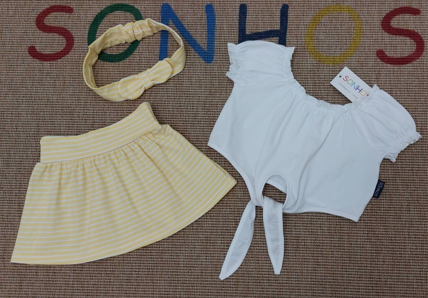 Conjunto saia riscas com fita